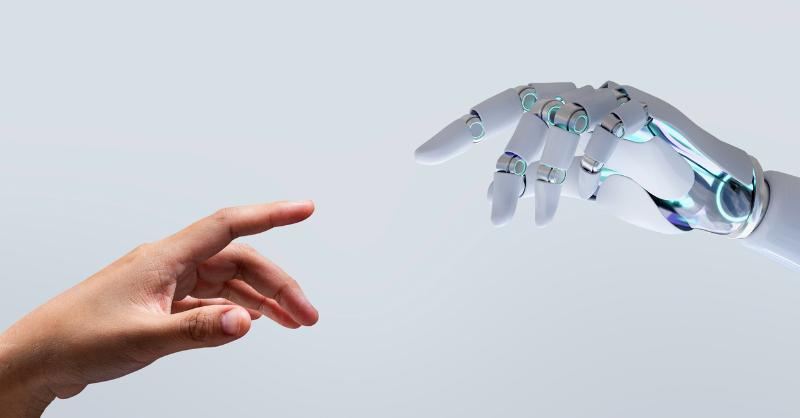 Main humaine qui tend vers une main robotisée